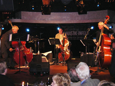 Bass Encounters featuring acoustic bassists, L-R, Arni Egilsson, Niels Henning Orsted, and Wayne Darling in Reykjavik, Iceland in 2004 (photo from allaboutjazz.com)